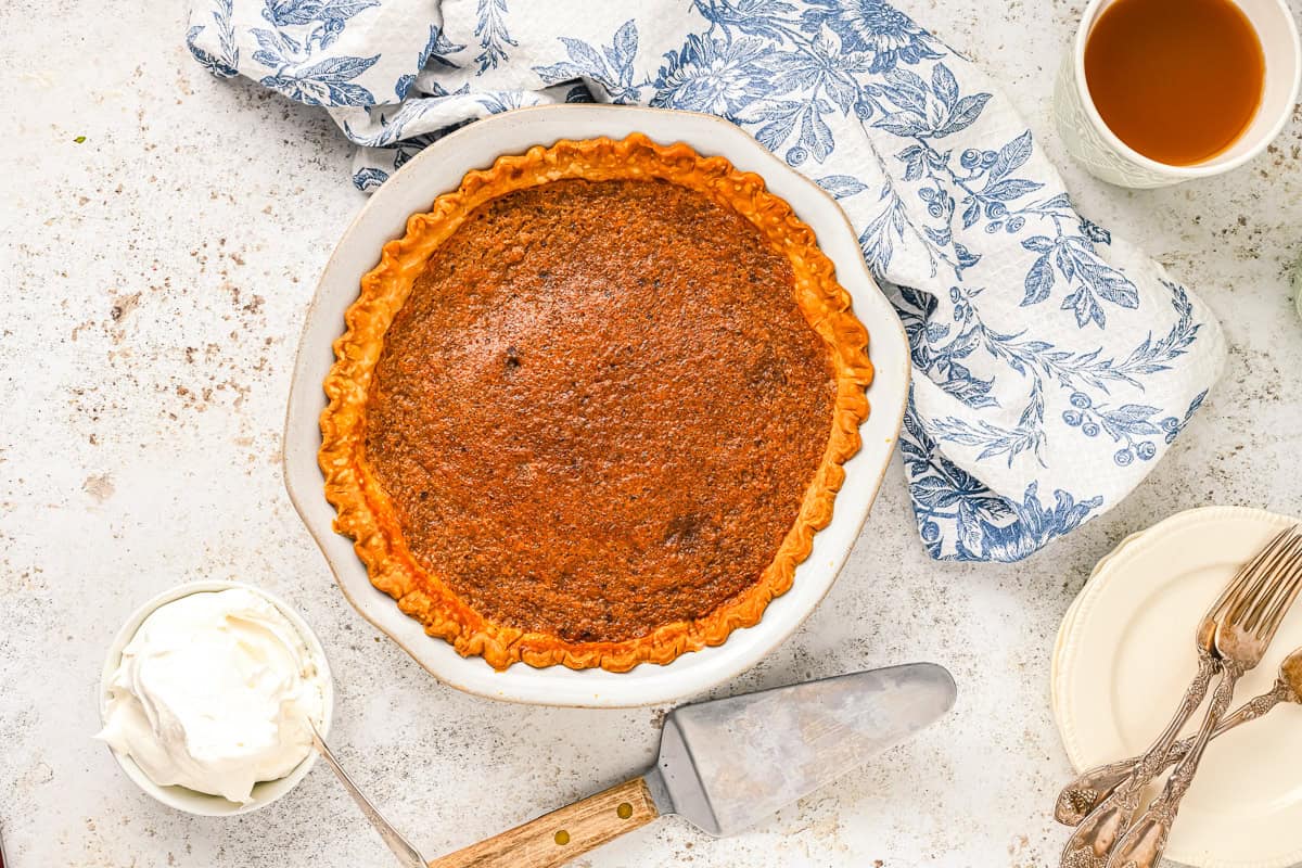 baked vinegar pie in a white pie pan.