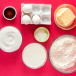 overhead view of portioned ingredients for peppermint santa cake in individual bowls.
