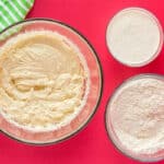 wet and dry ingredients for peppermint cake batter in glass bowls.