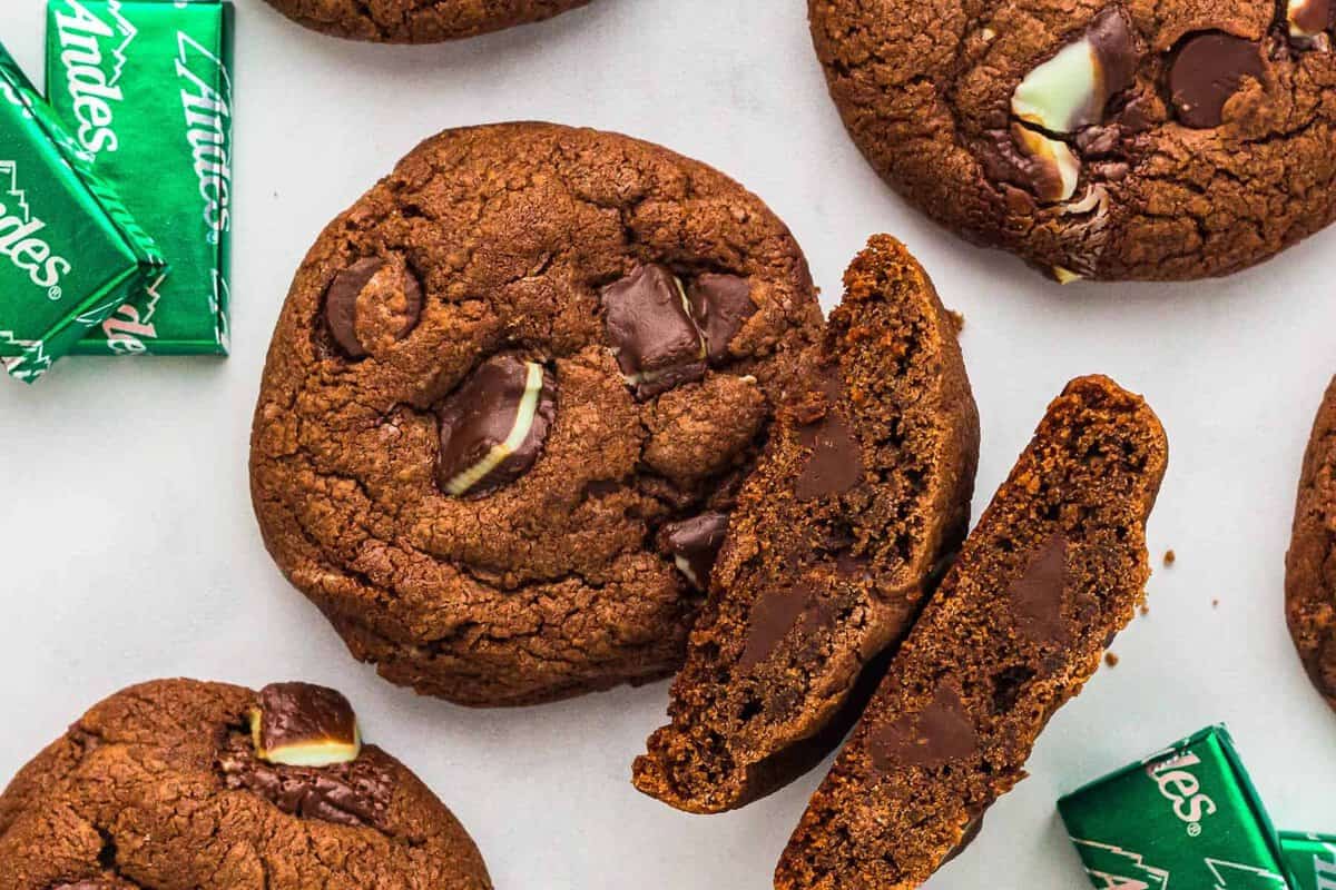 Mint chocolate cookies on a table with Andes chocolate mints.