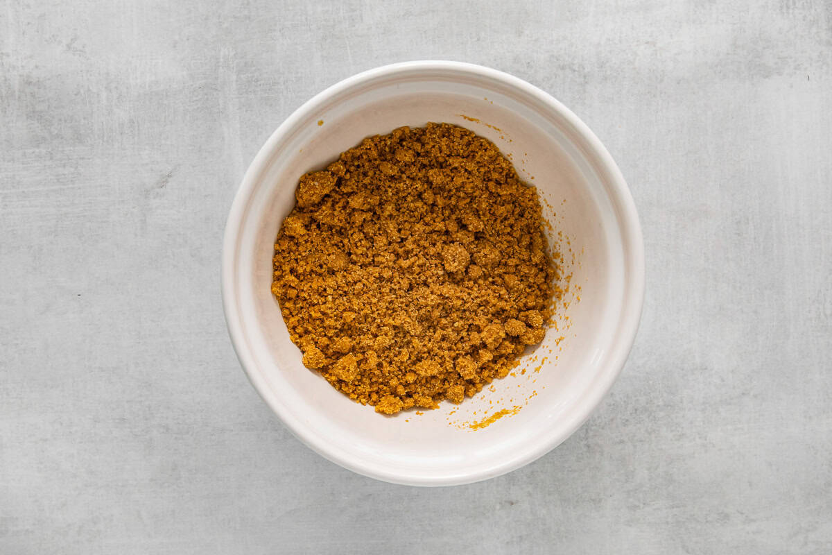graham cracker crust mix in a white bowl.