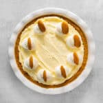 banana pudding pie topped with whipped cream and vanilla wafers.