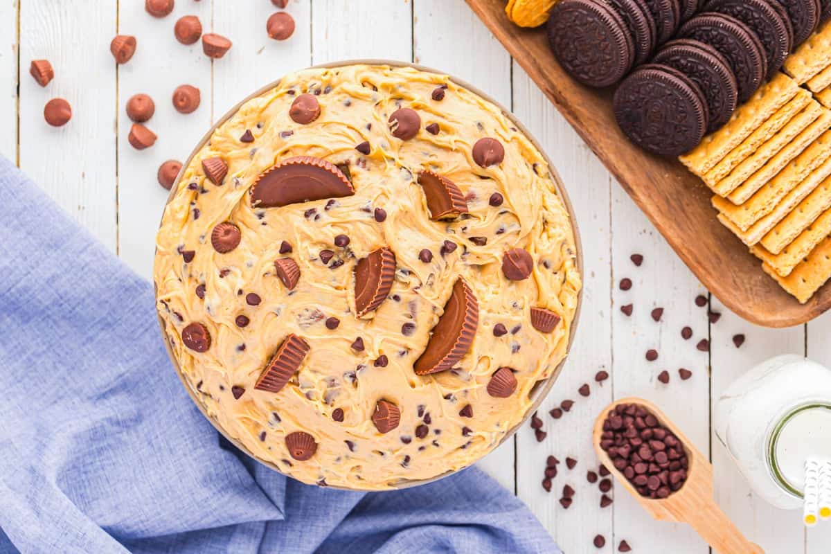peanut butter and marshmallow fluff dip topped with chopped peanut butter cups and chocolate chips.