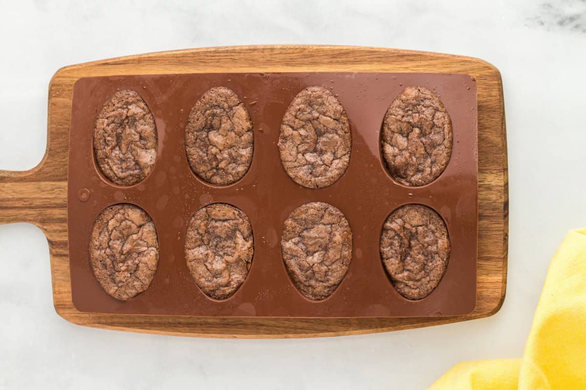 baked brownies in a silicone egg-shaped mold.