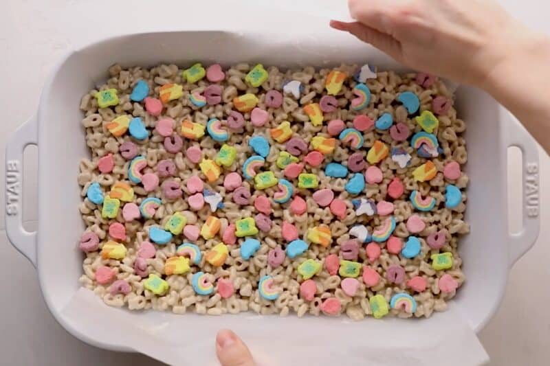 Lucky Charms marshmallow treats setting in a pan.