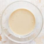 Thick batter in a glass bowl.