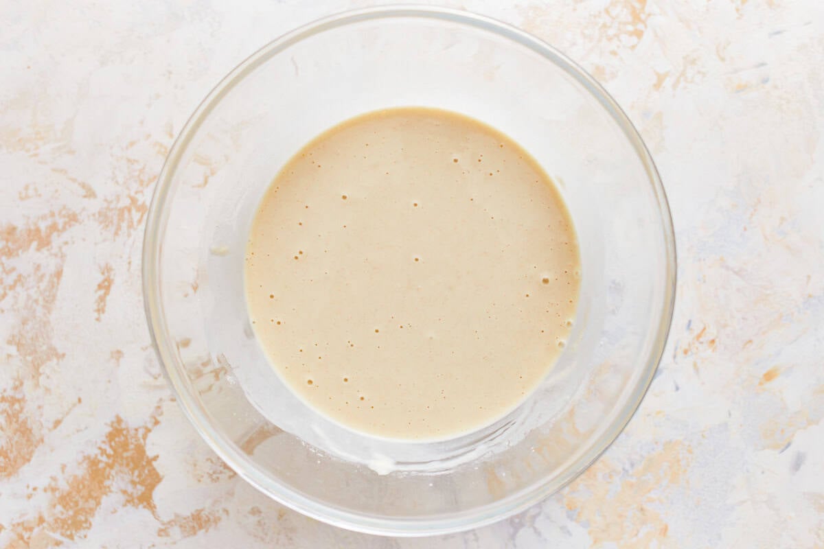 Thick batter in a glass bowl.