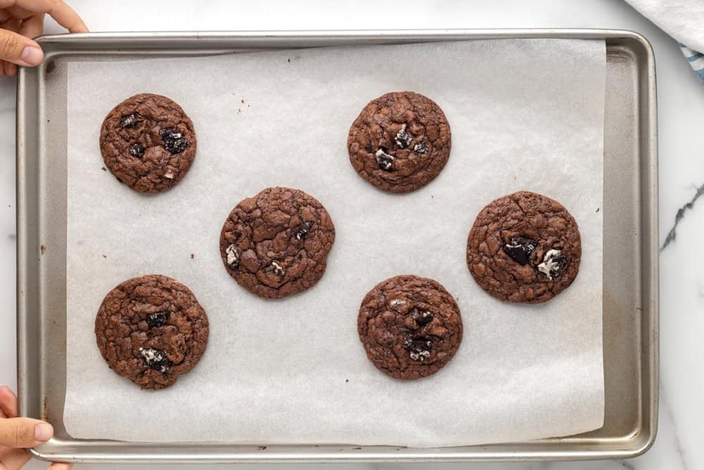 Baked Oreo brownie cookies on a baking tray.