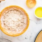 Shortening being cut into the dry ingredients.