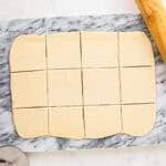 Dough cut into squares.