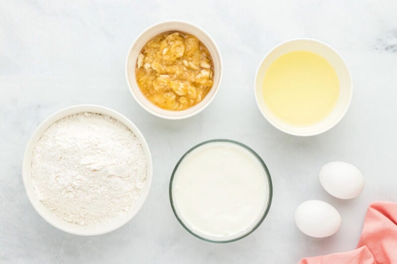 Bowls of cake mix, mashed bananas, oil, and melted ice cream.