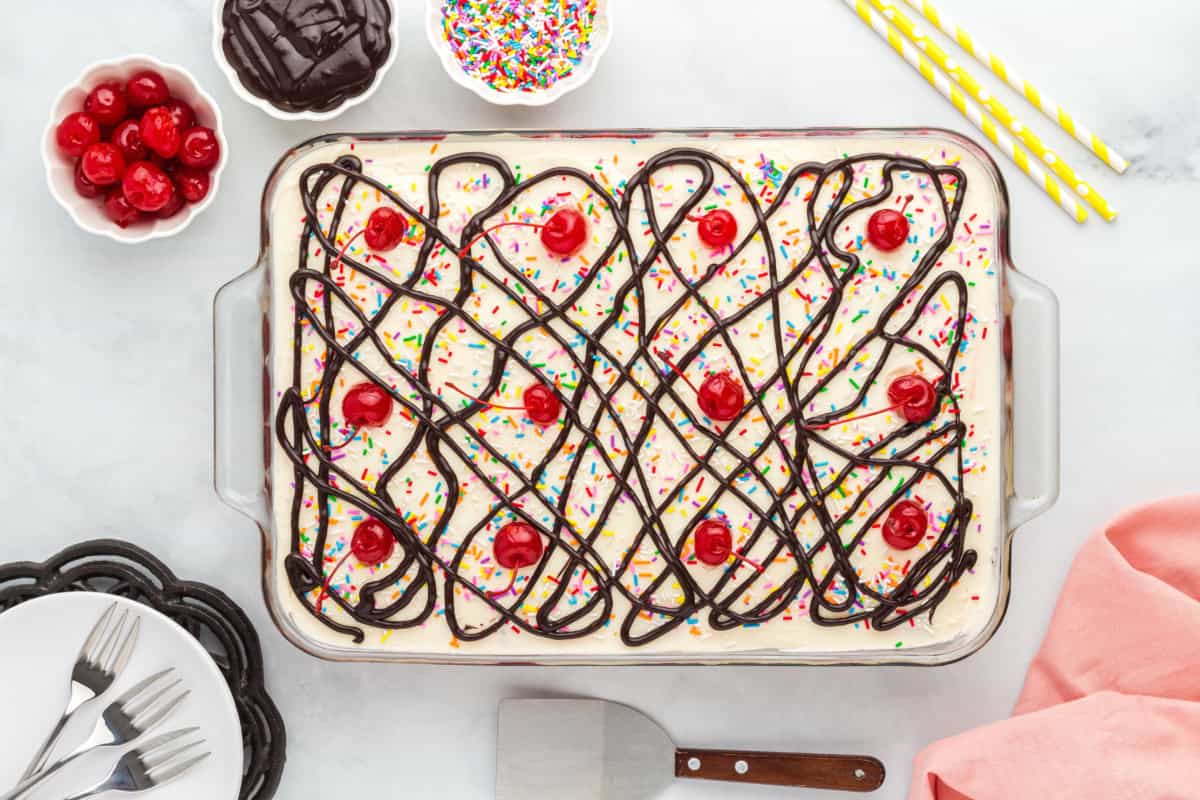 Decorated banana split sundae cake.