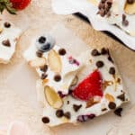 Two pieces of frozen yogurt bark stacked on top of each other.