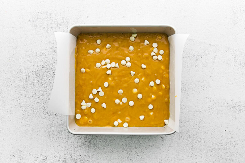 Blondie mixture poured into a baking tin.