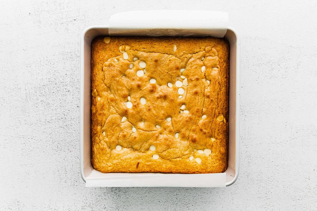 Baked blondies in a baking tin.