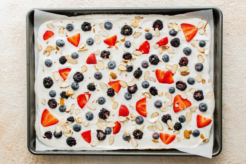 Berries and nuts sprinkled on the yogurt.