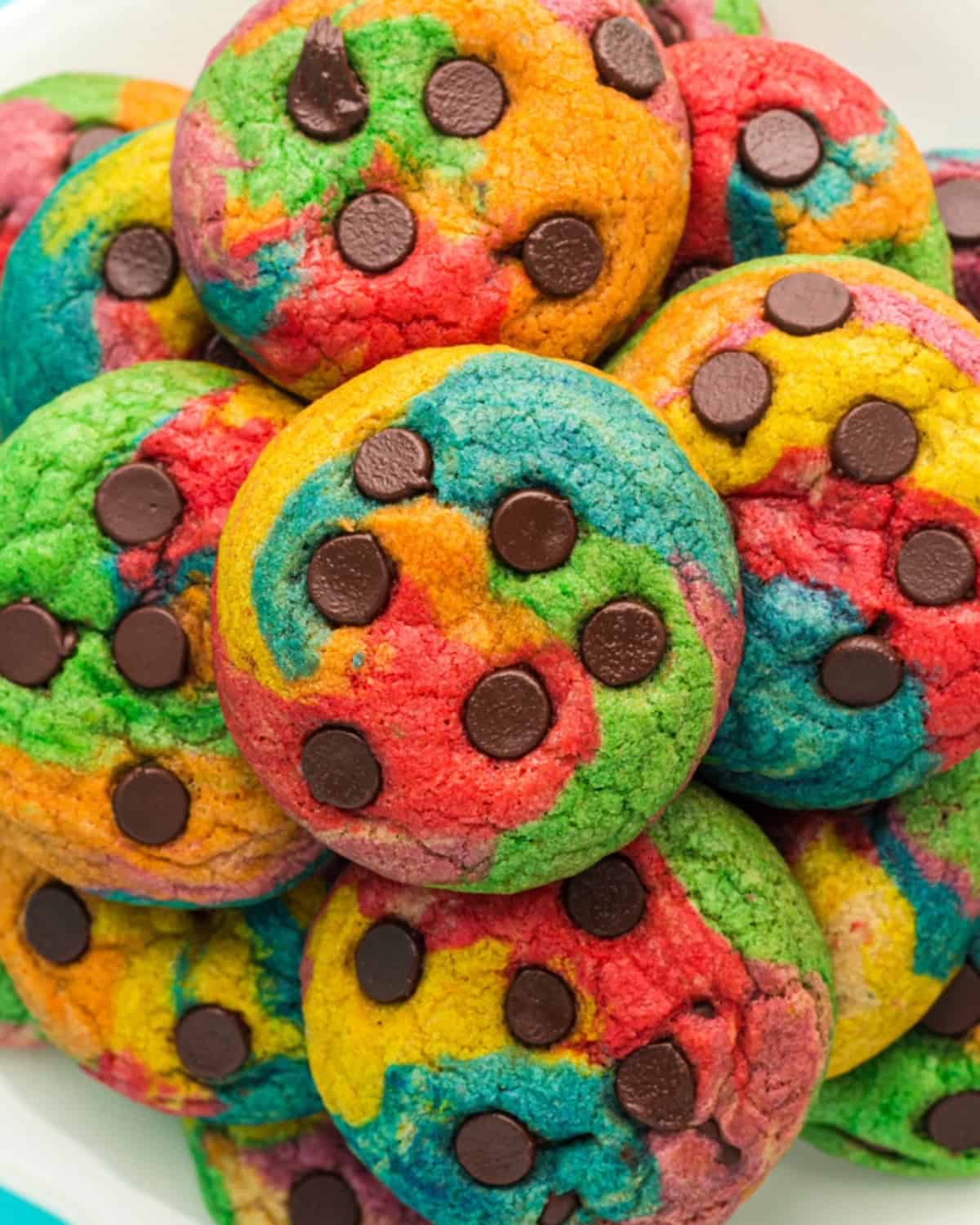 A plate of rainbow chocolate chip cookies.