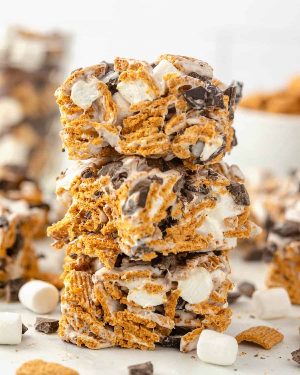 A stack of Golden Grahams s'mores cereal treat bars filled with marshmallows and chocolate.