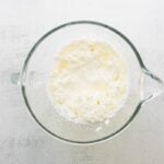Whipped cream in a mixing bowl.