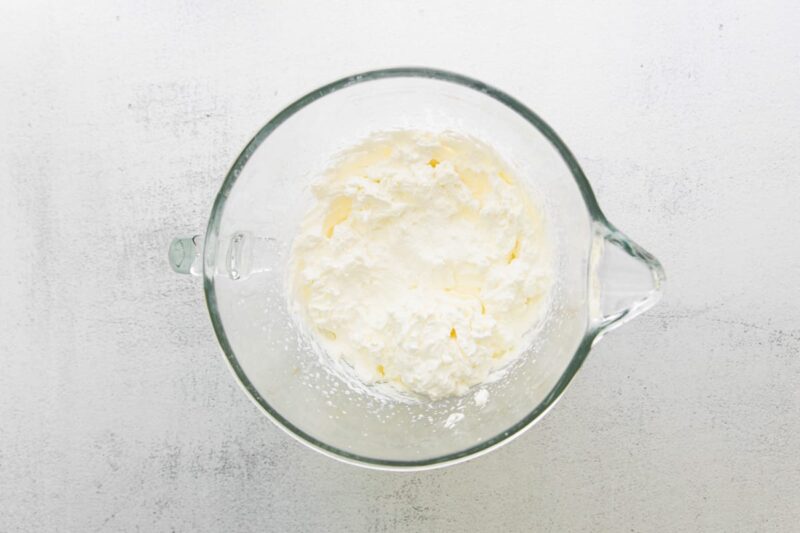 Whipped cream in a mixing bowl.