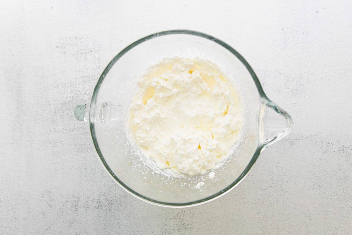 Whipped cream in a mixing bowl.