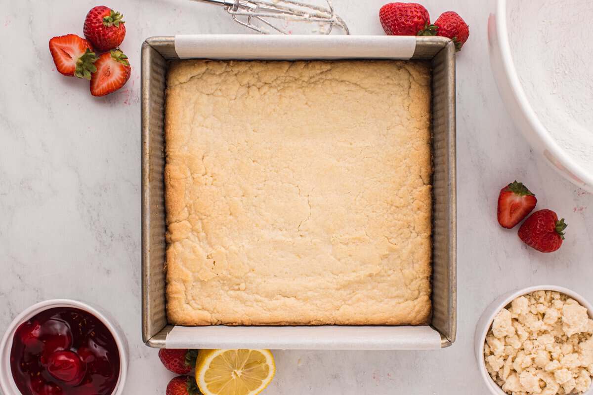Shortbread crust in a baking pan.