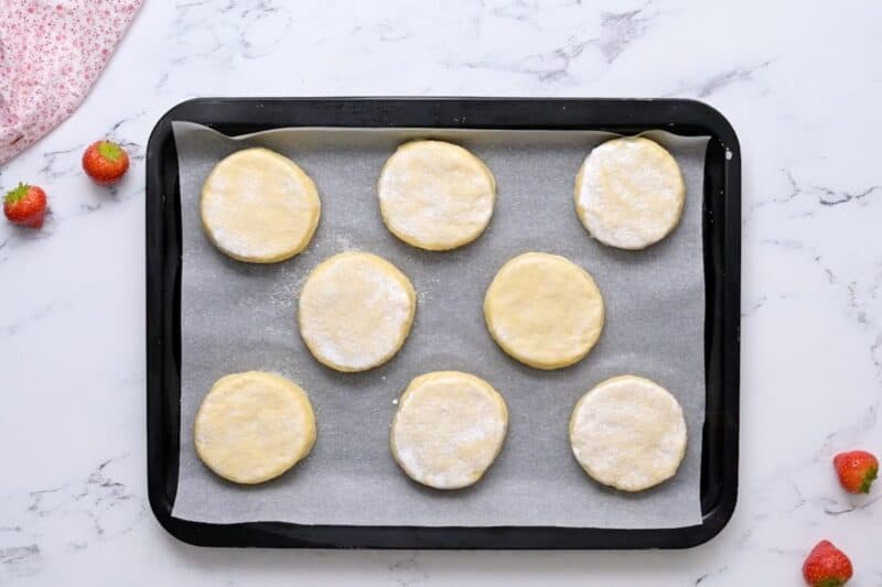 Unbaked biscuits coated with cream and sugar.
