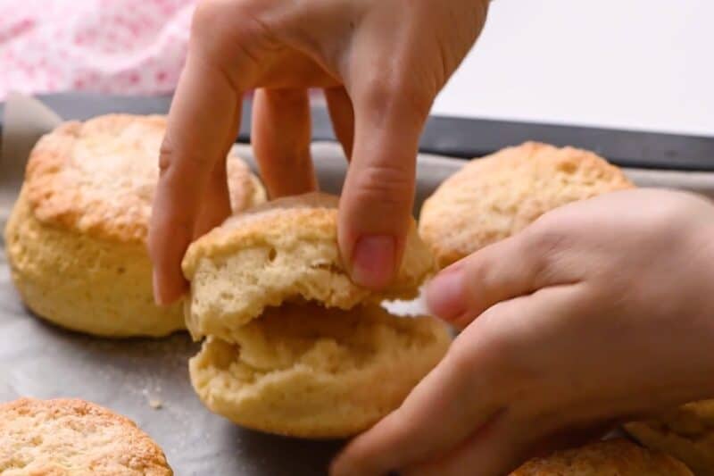 Pulling baked biscuits apart.