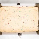 Funfetti cake batter in a baking dish ready to go in the oven.
