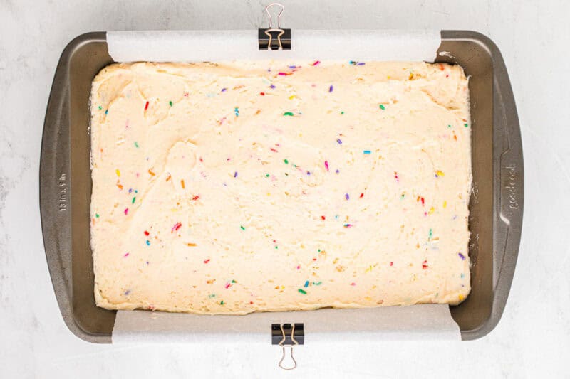 Funfetti cake batter in a baking dish ready to go in the oven.