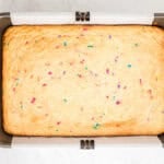 Funfetti cake bar in a baking pan fresh out of the oven.
