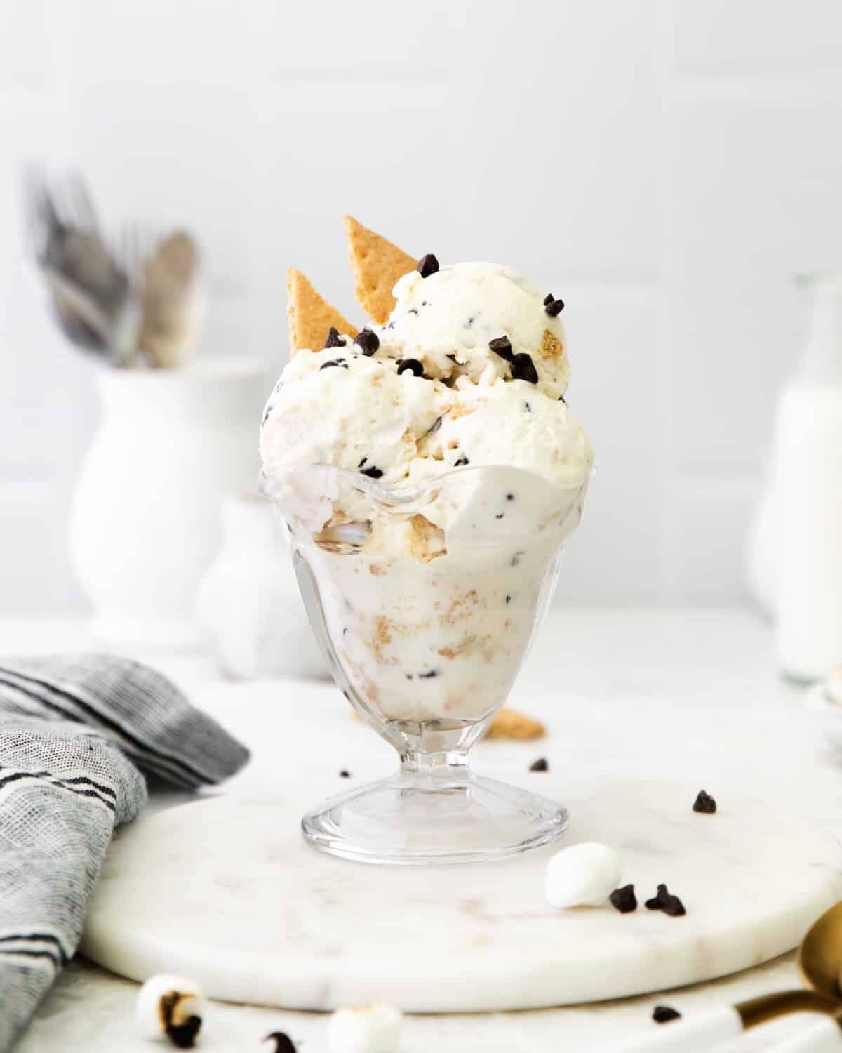 A glass dish filled with scoops of s'mores ice cream.