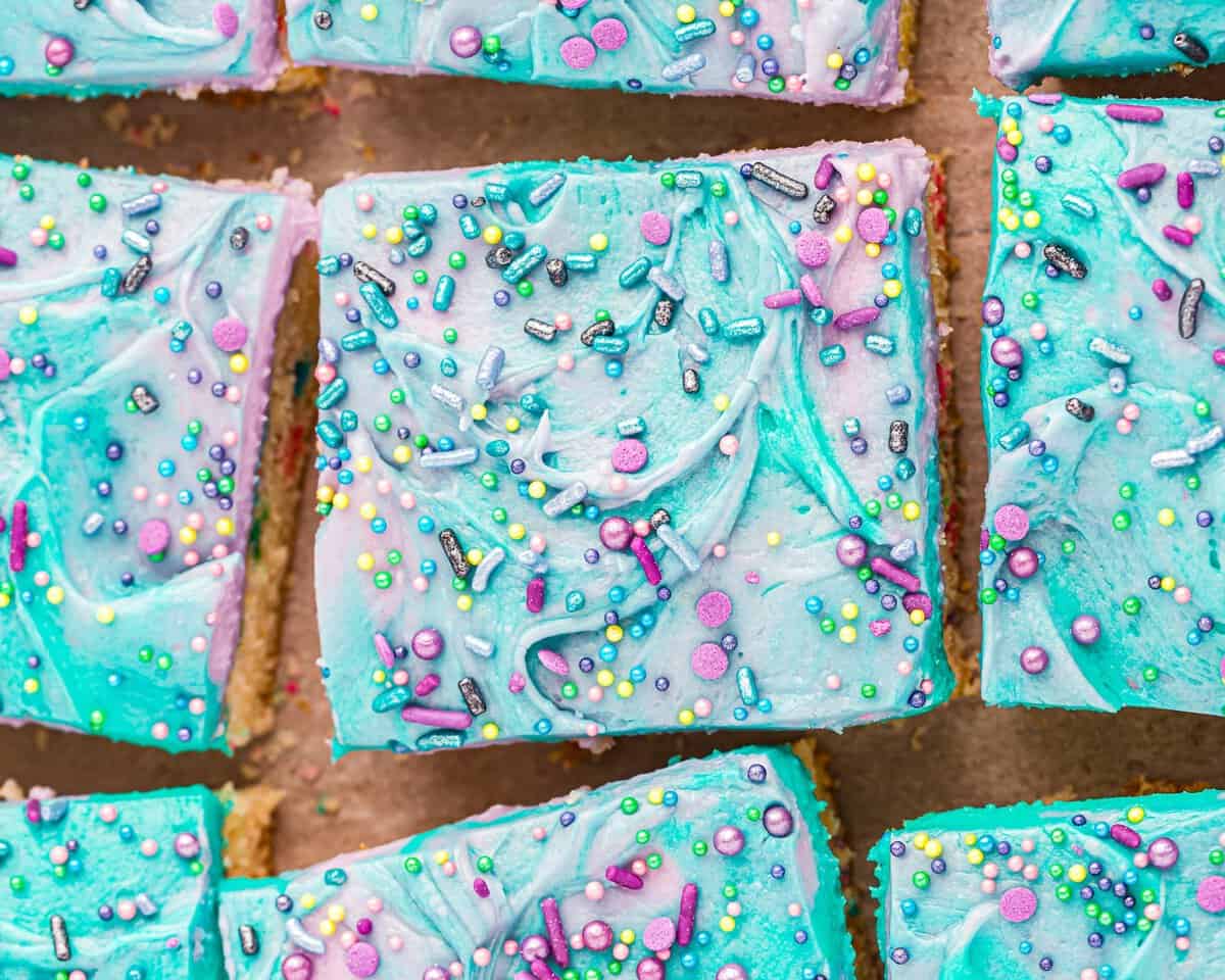 Unicorn-inspired funfetti cake bars cut into squares.