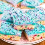 Unicorn bars stacked on each other on a serving plate.