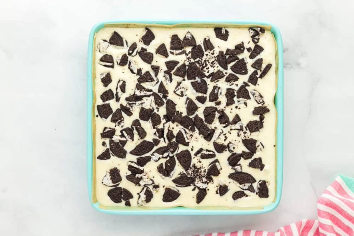 Cheesecake batter filled with crushed Oreo cookies.