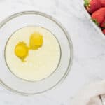 Wet ingredients in a glass mixing bowl.