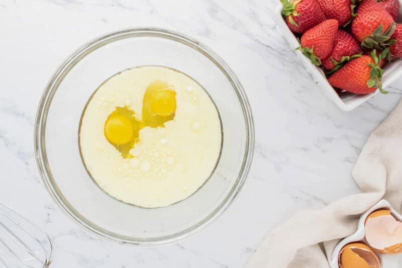 Wet ingredients in a glass mixing bowl.