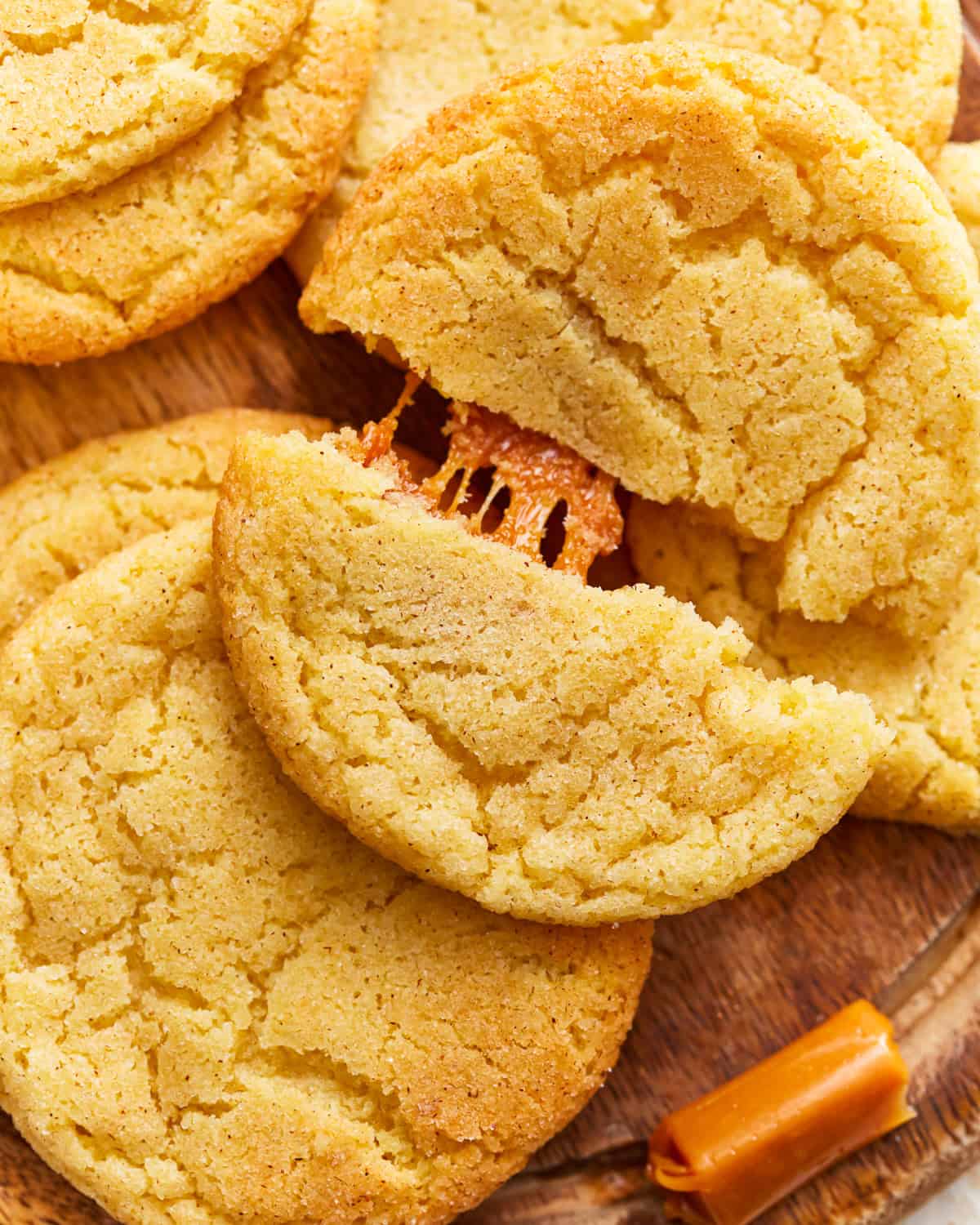 Close-up of caramel stuffed snickerdoodle cookies showing a gooey caramel filling.