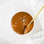 Dairy-free caramel sauce in a small dish.