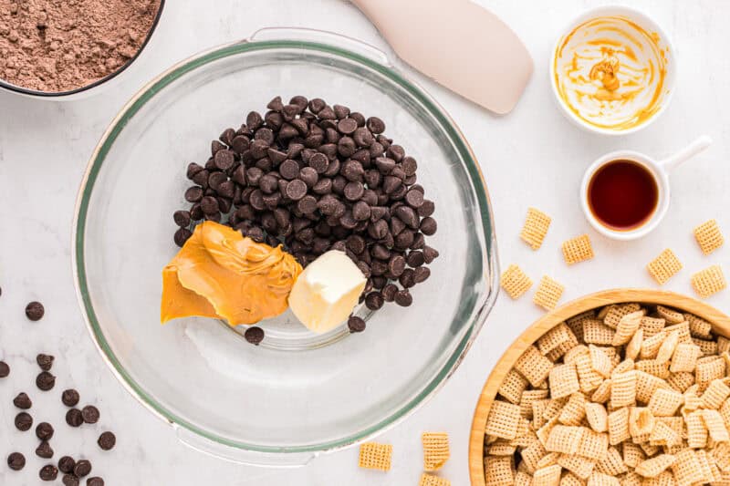 Chocolate chips, peanut butter, and butter in a mixing bowl.