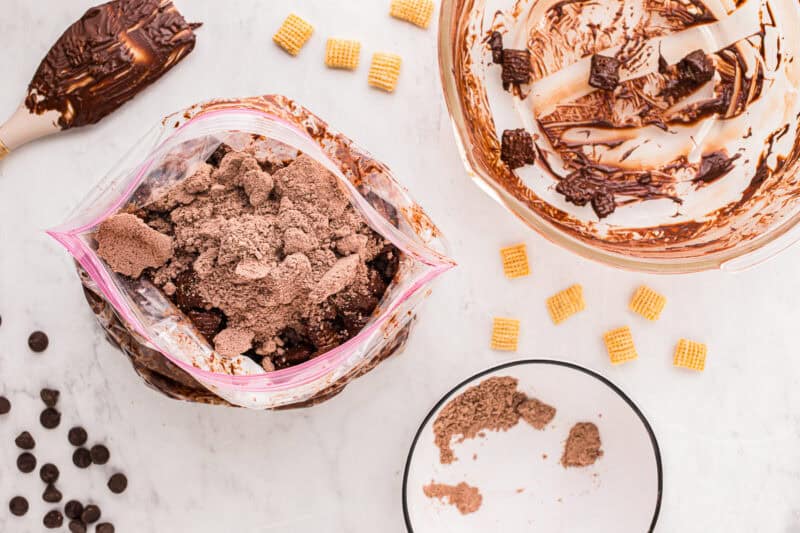 Brownie mix added to a resealable bag with chocolate-coated puppy chow.