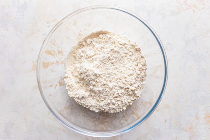 A glass mixing bowl of flour.