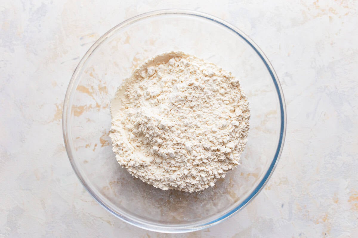 A glass mixing bowl of flour.