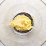 Creamed butter and sugar in a glass mixing bowl.