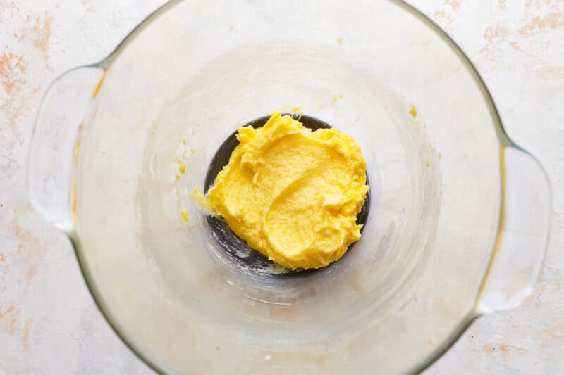 Wet dough in a glass mixing bowl.