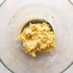 Cookie dough in a glass mixing bowl.