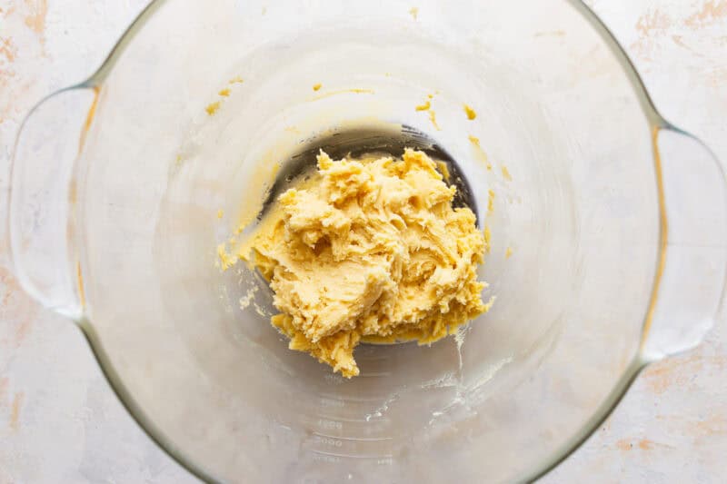 Cookie dough in a glass mixing bowl.