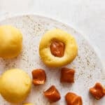A caramel candy pushed into snickerdoodle dough.