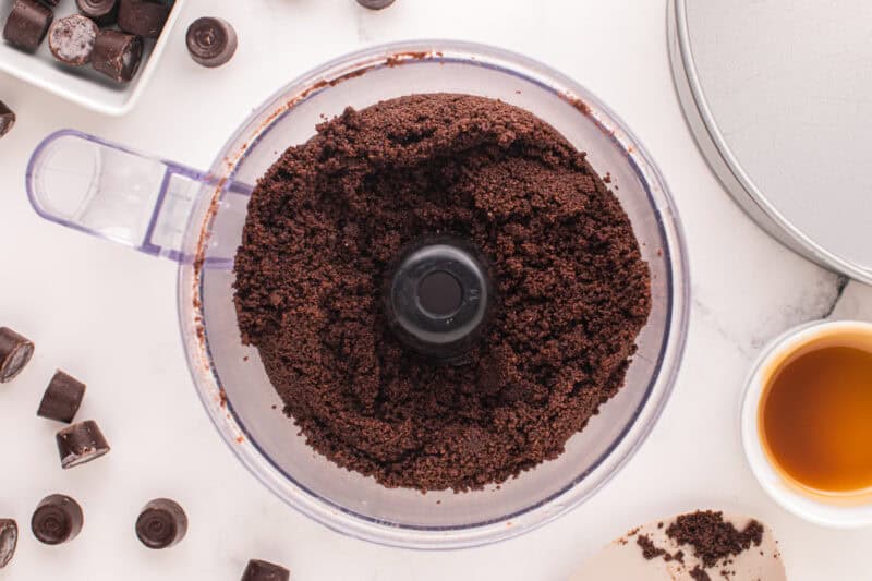 Chocolate cheesecake crust combined in a food processor.