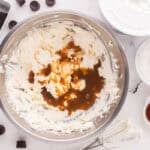 Cheesecake batter ingredients in a mixing bowl.